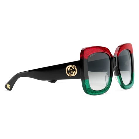 gucci green and black sunglasses.